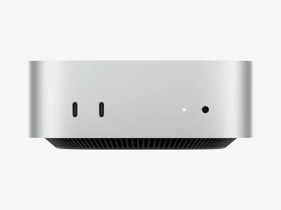 Apple Mac mini M6, a small silver square computer