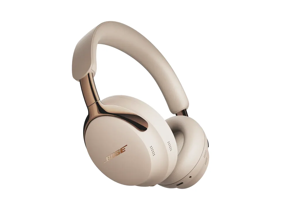 Bose QuietComfort Ultra Headphones (2nd Gen) in beige Driftwood Sand with copper-tone arms