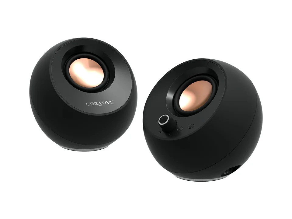 Pair of black Creative Pebble Pro round desktop speakers with copper-coloured drivers