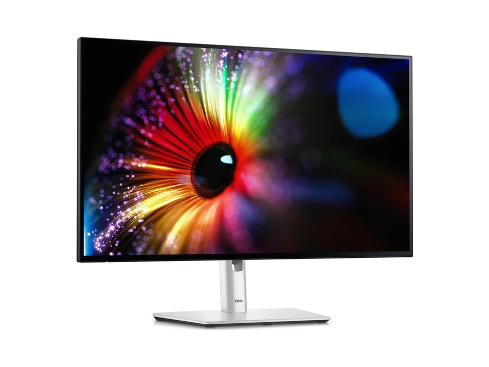 Dell UltraSharp U2724D monitor with silver stand, seen at an angle