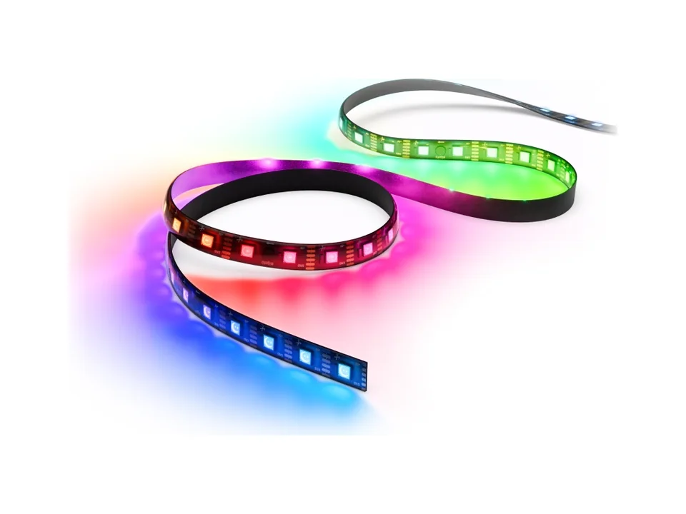 Elgato Light Strip Pro coiled with its LEDs lit in red, green, blue and purple, on a plain background