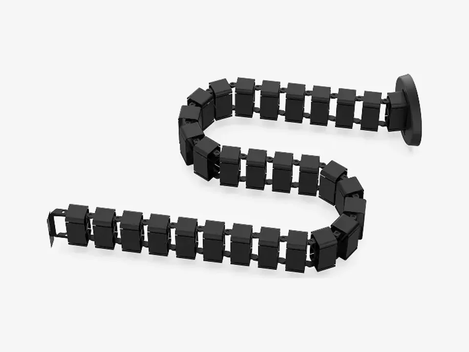 Columna pasacables FlexiSpot CMP017 negra de segmentos de plástico enlazados con su base redonda, sobre fondo blanco