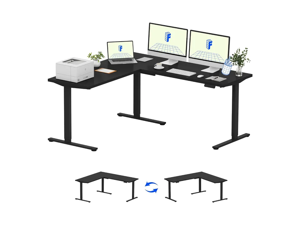 Black FlexiSpot L-shaped corner standing desk with two monitors on the long side, three-quarter view
