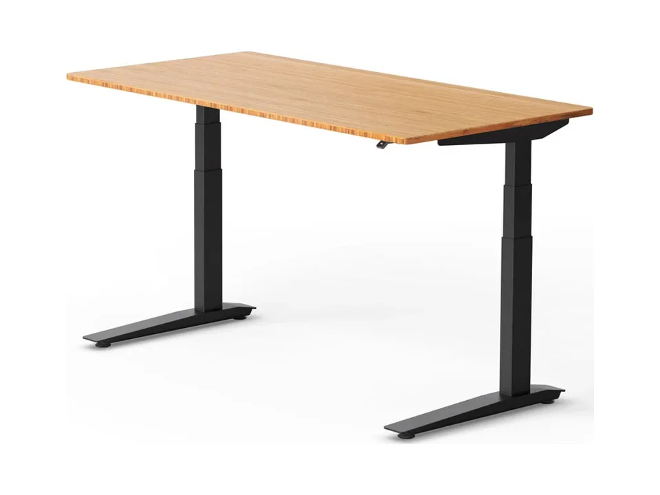 Jarvis standing desk with a rectangular bamboo top and black frame, three-quarter view on white
