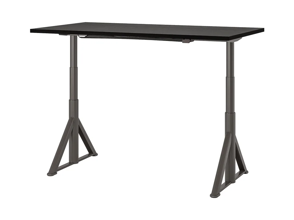 IKEA IDÅSEN sit/stand desk with a black top and a dark gray frame, three-quarter view