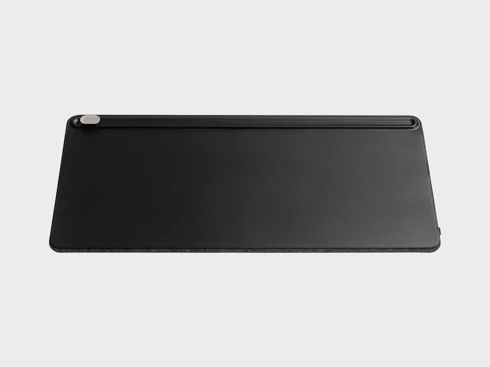 Black Orbitkey Desk Mat Large seen from the front with its toolbar and magnetic cable holder