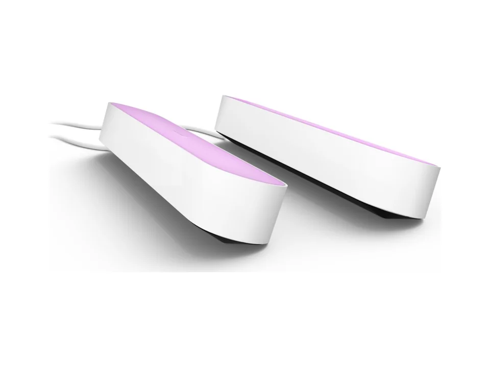 Two white Philips Hue Play light bars lying side by side with a pink glow, on a white background