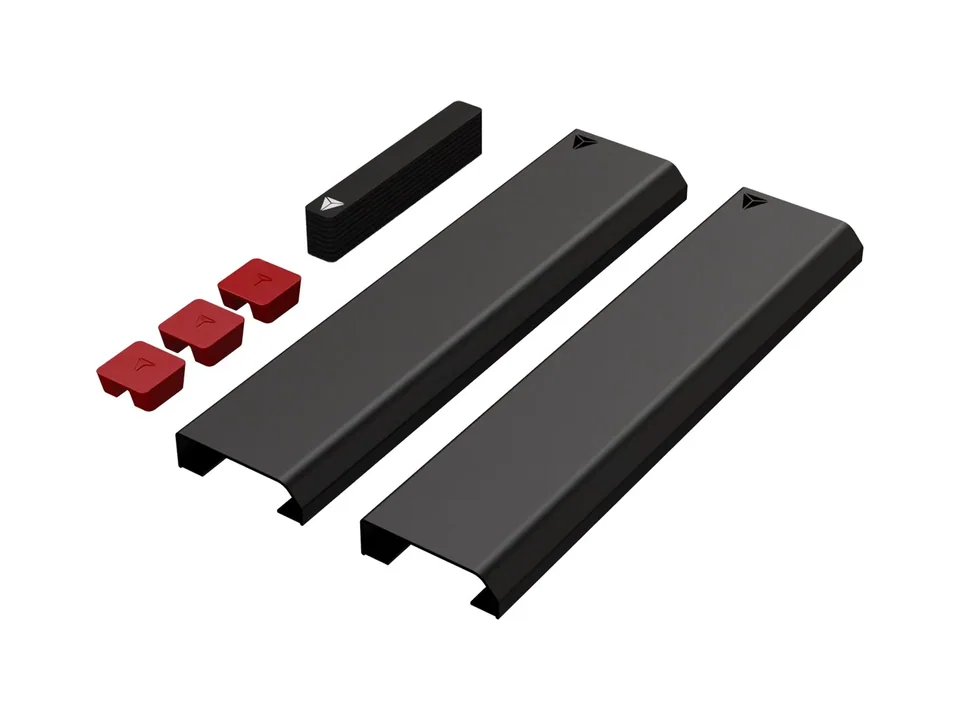 Black Secretlab magnetic cable sheaths, a stack of straps and three red cable anchors, on a white background