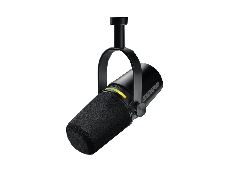 Black Shure MV7+ podcast microphone on its yoke with lit LED touch panel, three-quarter view