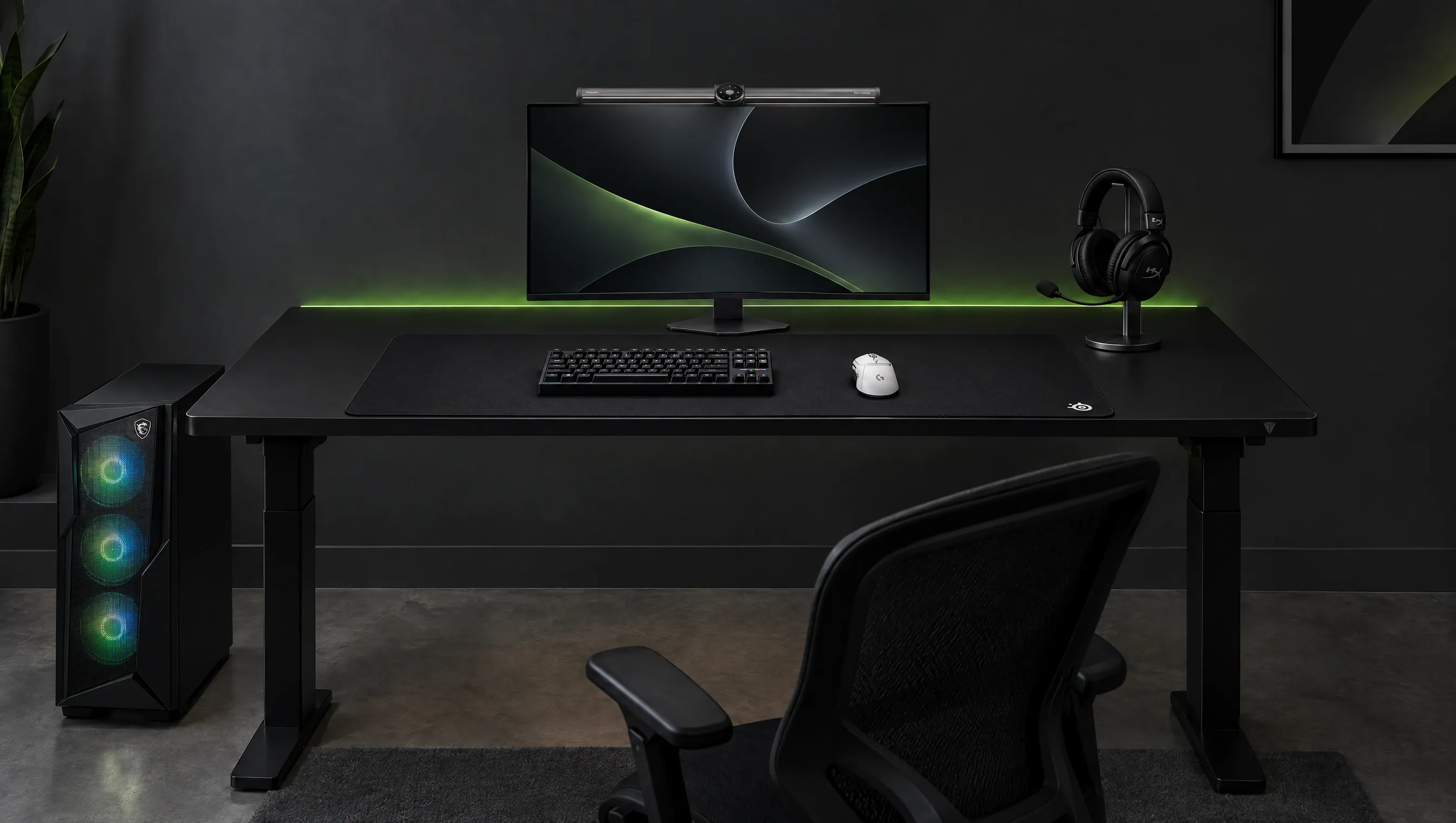 Black sit/stand desk in a dark room with an LG UltraGear OLED monitor under a BenQ light bar, a black Wooting keyboard and a white Logitech mouse on a large SteelSeries pad, a HyperX headset on a stand on the right, an MSI tower with green and blue fans on the floor on the left, a black gaming chair in front and a green light line on the wall